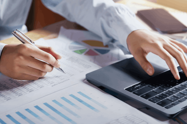 Bonus depreciation percentage by year chart review on laptop and financial reports