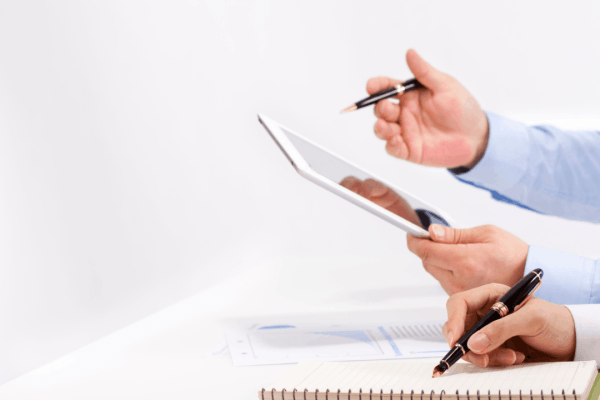 How does bonus depreciation work – tax professional reviewing financial documents and taking notes with a pen