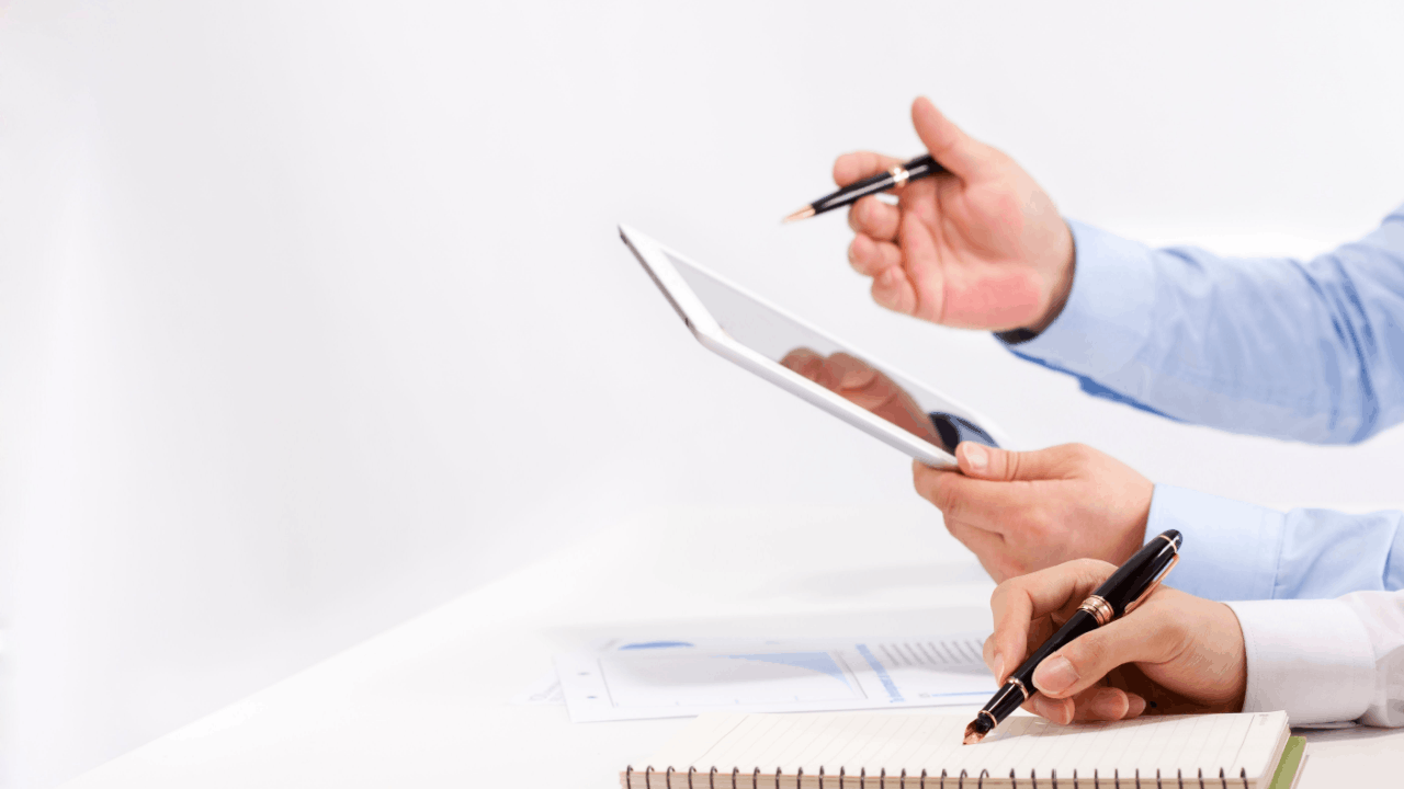 How does bonus depreciation work – tax professional reviewing financial documents and taking notes with a pen