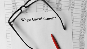 How to Request Garnishment Release IRS Document With Glasses and Pen