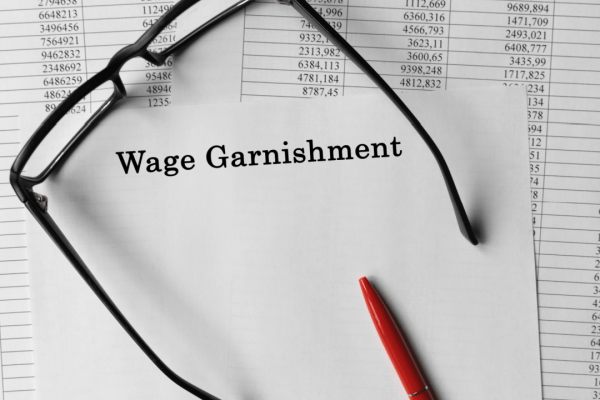 How to Request Garnishment Release IRS Document With Glasses and Pen