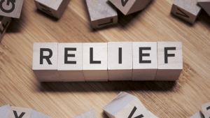IRS wage garnishment relief options spelled in wooden letter blocks