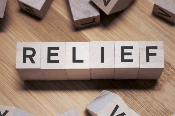 IRS wage garnishment relief options spelled in wooden letter blocks