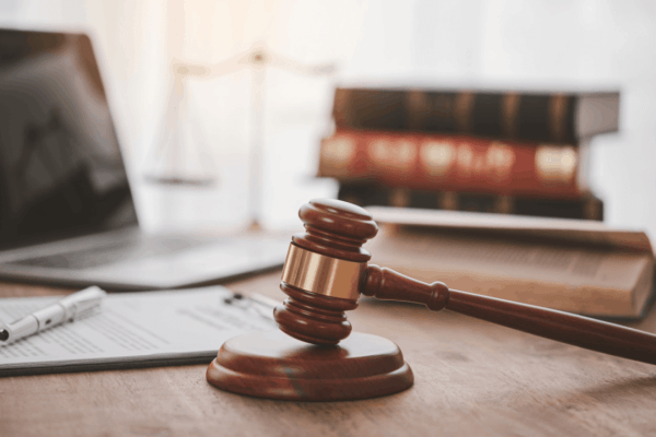 Gavel and law books on a desk representing IRS wage garnishment laws and federal tax collection authority