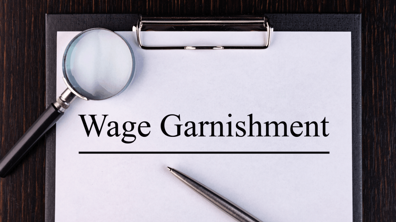 Clipboard document labeled wage garnishment highlighting IRS wage garnishment rules